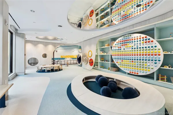 a living room with furniture a rug and a table