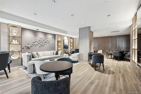 a bedroom with furniture and a wooden floor