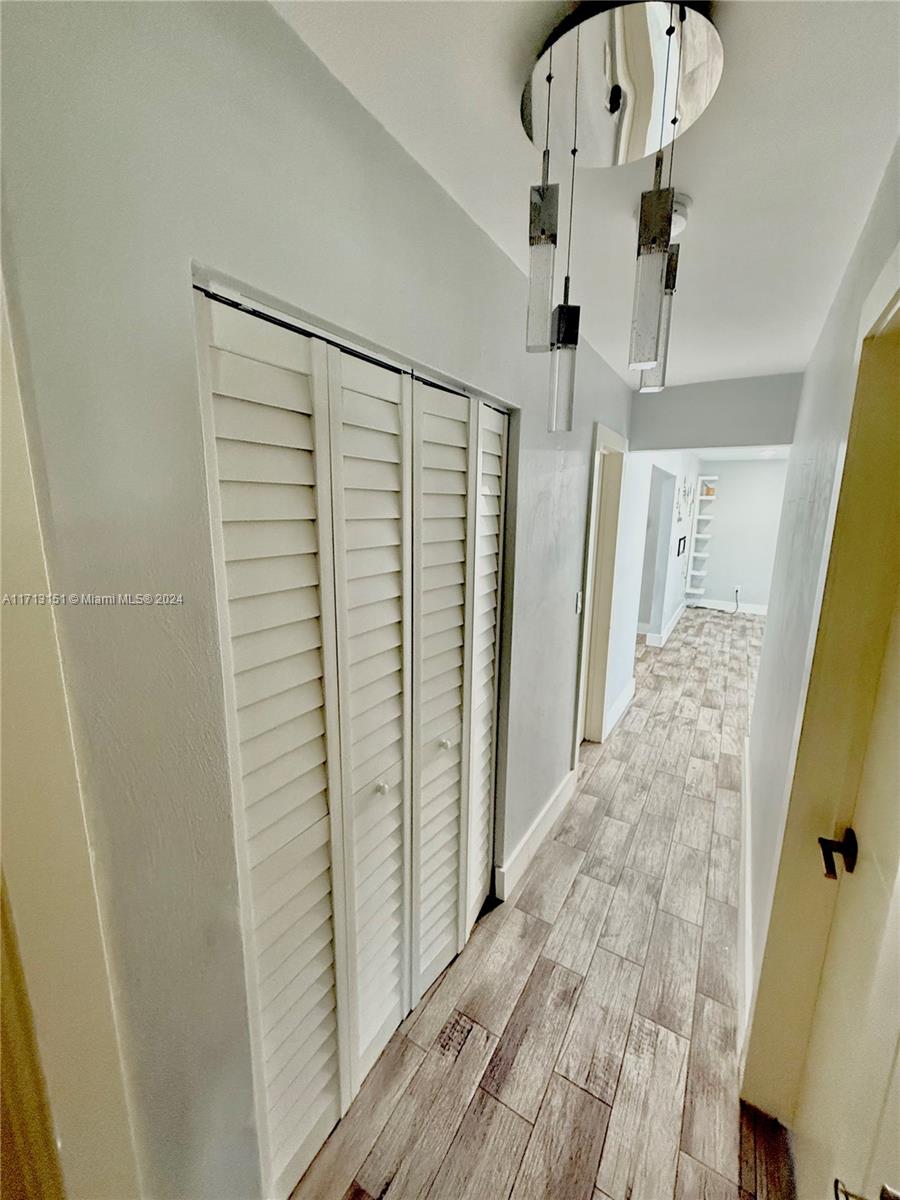 Fairway Estates Miami, FL 33157 - Photo 14 of 34 a view of a hallway with wooden floor and staircase