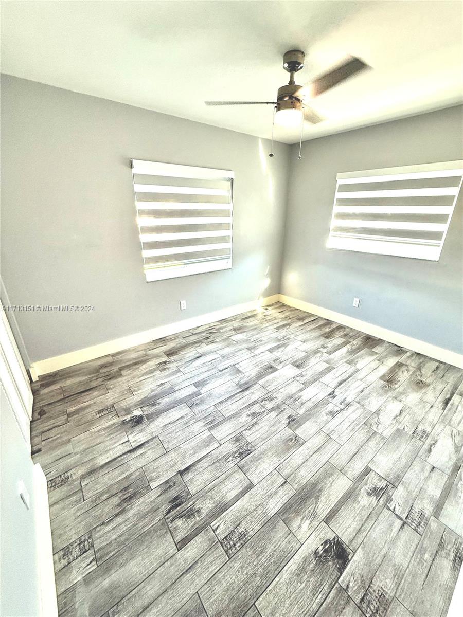 Fairway Estates Miami, FL 33157 - Photo 19 of 34 a view of a bedroom with a bed and a window