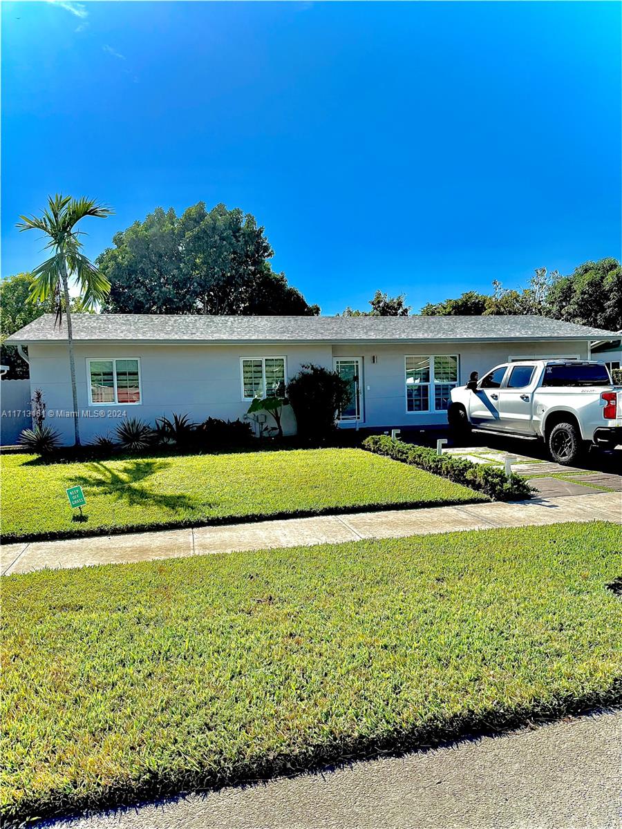 Fairway Estates Miami, FL 33157 - Photo 2 of 34 a front view of a house with a garden and yard