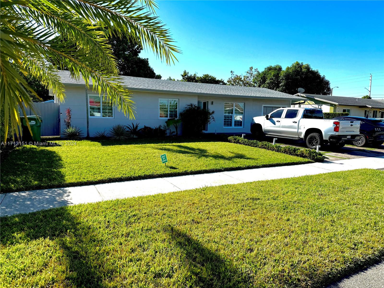 Fairway Estates Miami, FL 33157 - Photo 34 of 34 a front view of a house with a garden and yard
