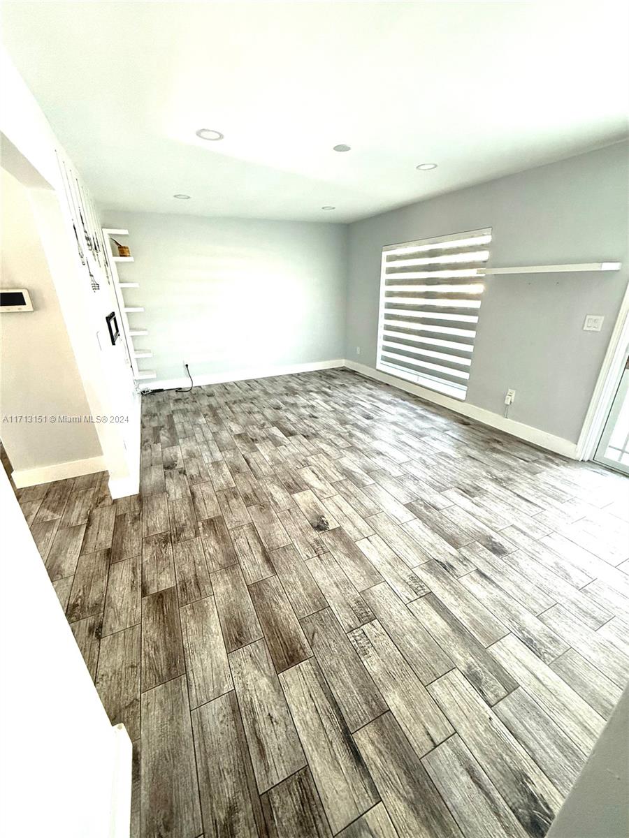 Fairway Estates Miami, FL 33157 - Photo 6 of 34 a view of a bedroom with wooden floor and windows