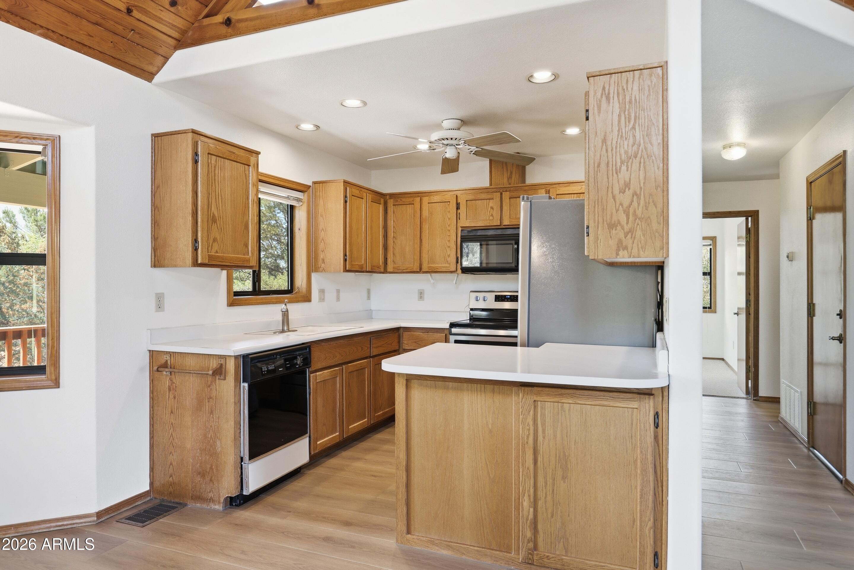 1405 East Graham Rnch Trail Payson, AZ 85541 - Photo 11 of 46 a kitchen with stainless steel appliances granite countertop a sink a stove and a refrigerator