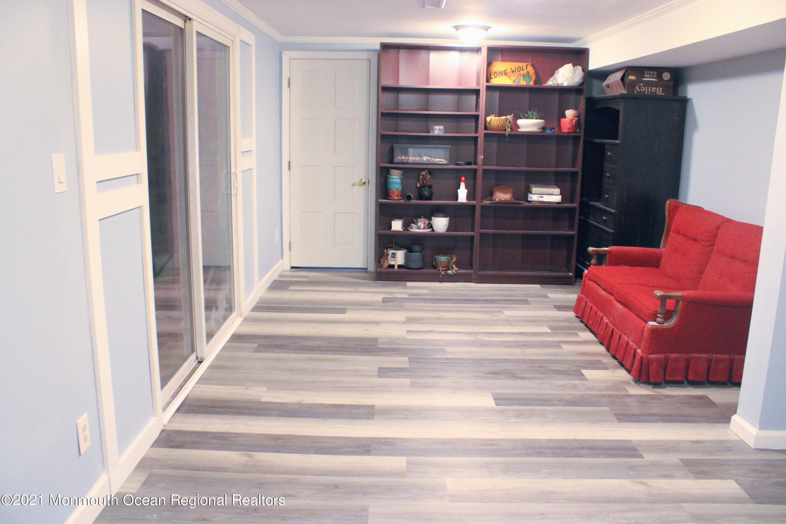 319 Aldrich Road Howell, NJ 07731 - Photo 8 of 10 a spacious bedroom with a bed and a book shelf