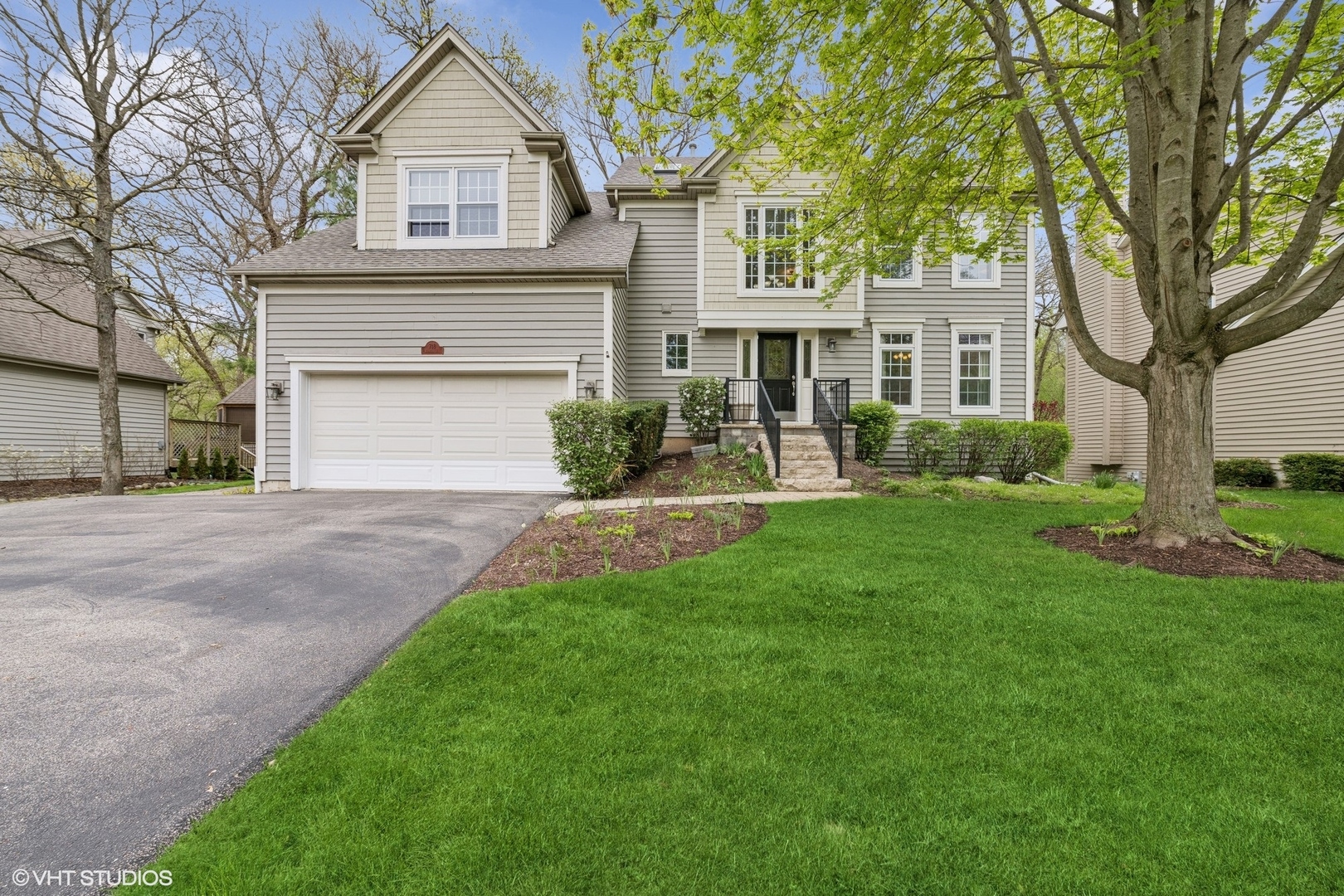 718 Barberry Trail Fox River Grove, IL 60021 - Photo 37 of 37 a front view of a house with a yard and trees