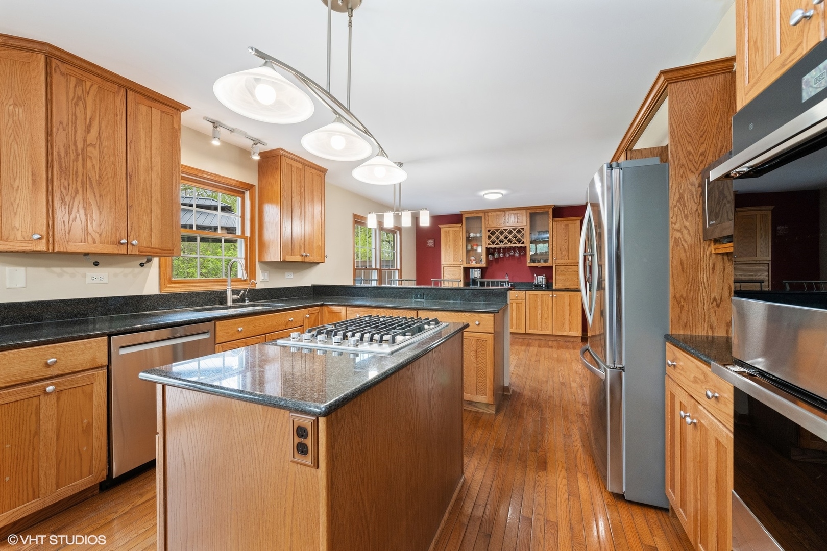 718 Barberry Trail Fox River Grove, IL 60021 - Photo 5 of 37 a kitchen with granite countertop a sink cabinets and wooden floor