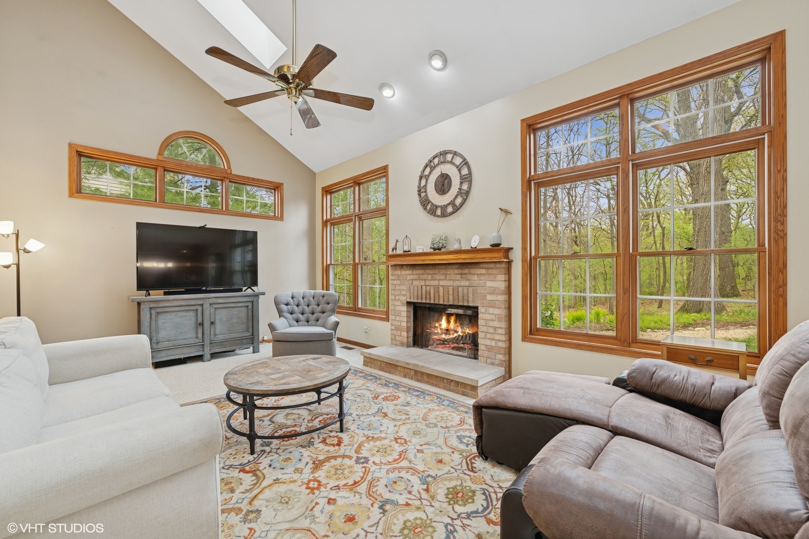 718 Barberry Trail Fox River Grove, IL 60021 - Photo 8 of 37 a living room with furniture a flat screen tv and a fireplace