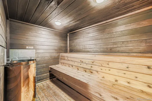 a view of a swimming pool with outdoor seating