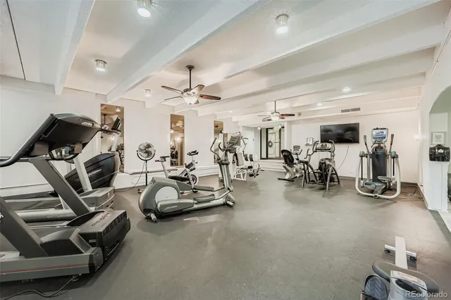 a room with pool table and windows