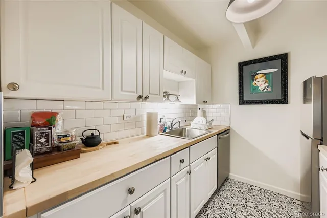 a kitchen with a sink and cabinets