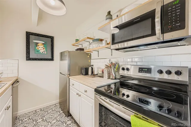 a kitchen with a stove and a microwave
