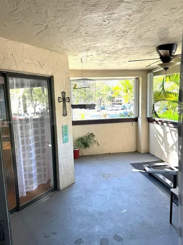 a view of room with window and front door