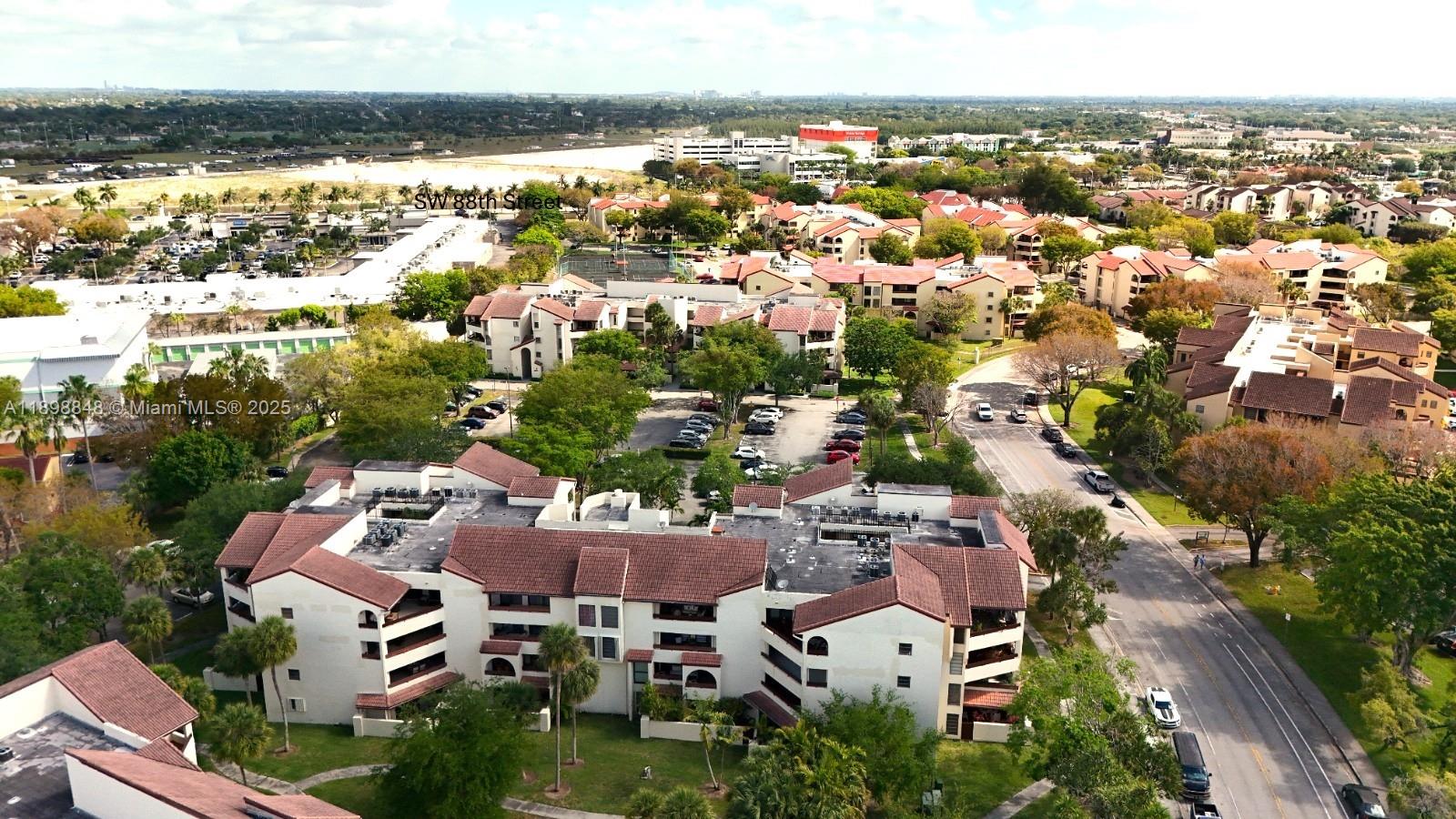 9030 Southwest 125th Avenue, Unit E210 Miami, FL 33186 - Photo 6 of 18 an aerial view of residential houses with city view