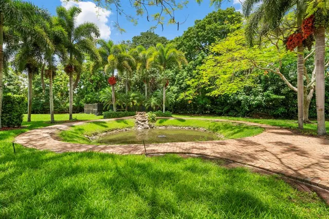 a view of a hardwood floor and a living room