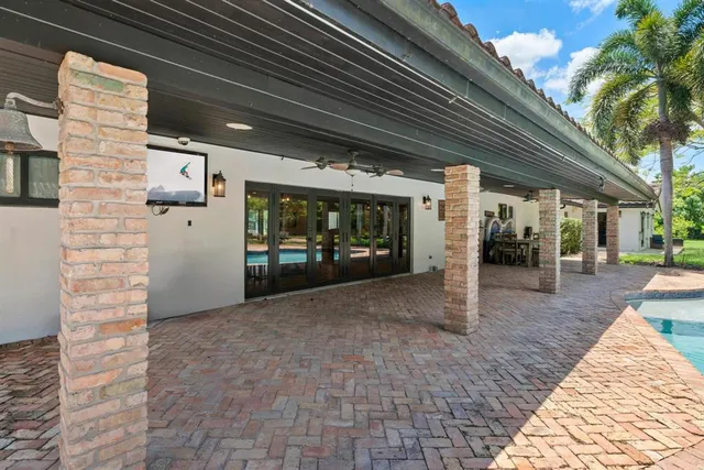 a bathroom with a toilet a sink and a mirror