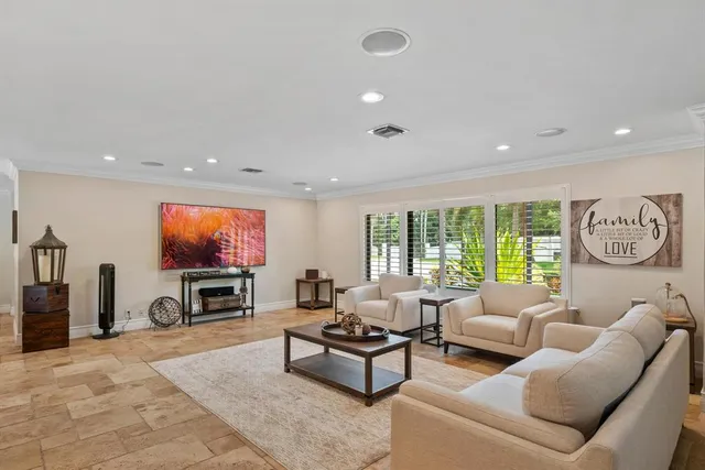 an aerial view of a house with yard swimming pool and outdoor seating