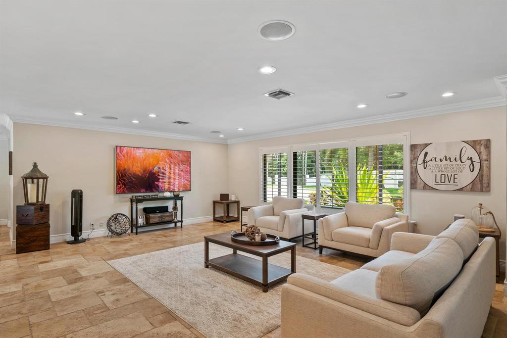 14701 Southwest 63rd Street Southwest Ranches, FL 33330 - Photo 25 of 75 a living room with furniture and a flat screen tv