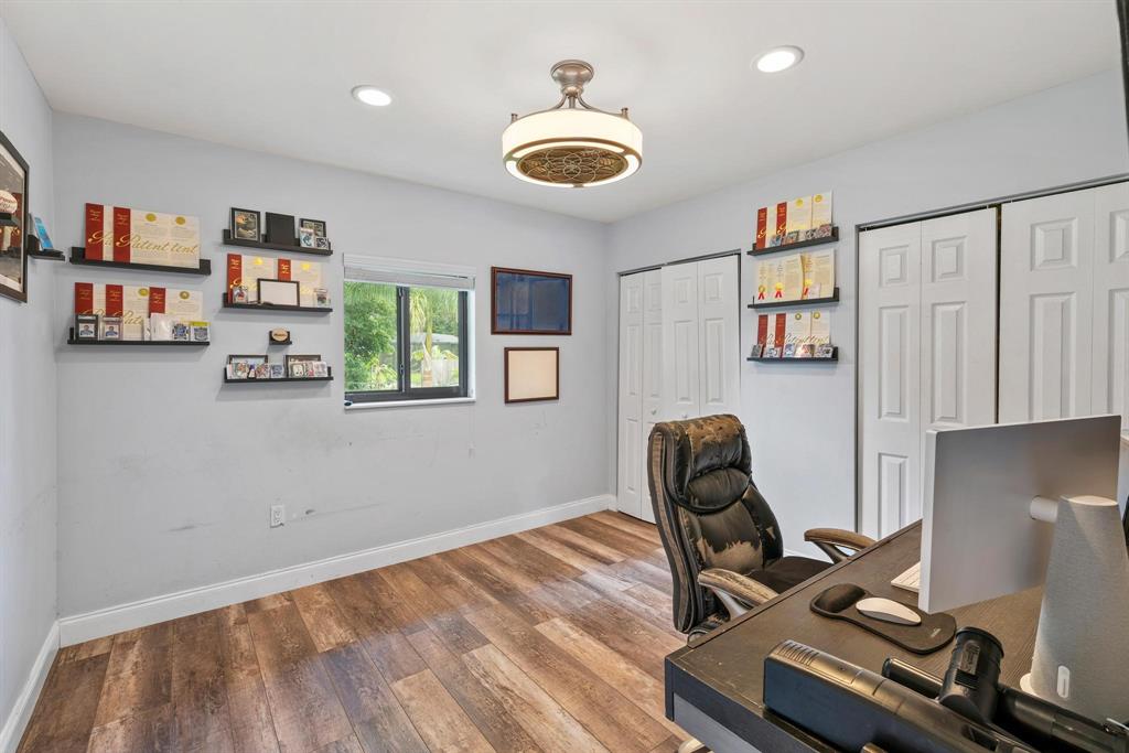 14701 Southwest 63rd Street Southwest Ranches, FL 33330 - Photo 52 of 75 a room with gym equipment and a window