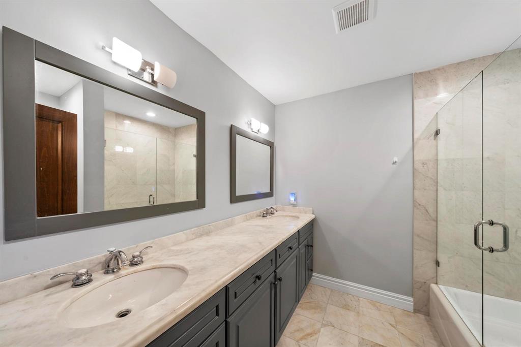 14701 Southwest 63rd Street Southwest Ranches, FL 33330 - Photo 57 of 75 a bathroom with a double vanity sink mirror and shower