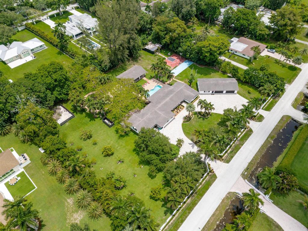 14701 Southwest 63rd Street Southwest Ranches, FL 33330 - Photo 71 of 75 an aerial view of a residential houses with outdoor space