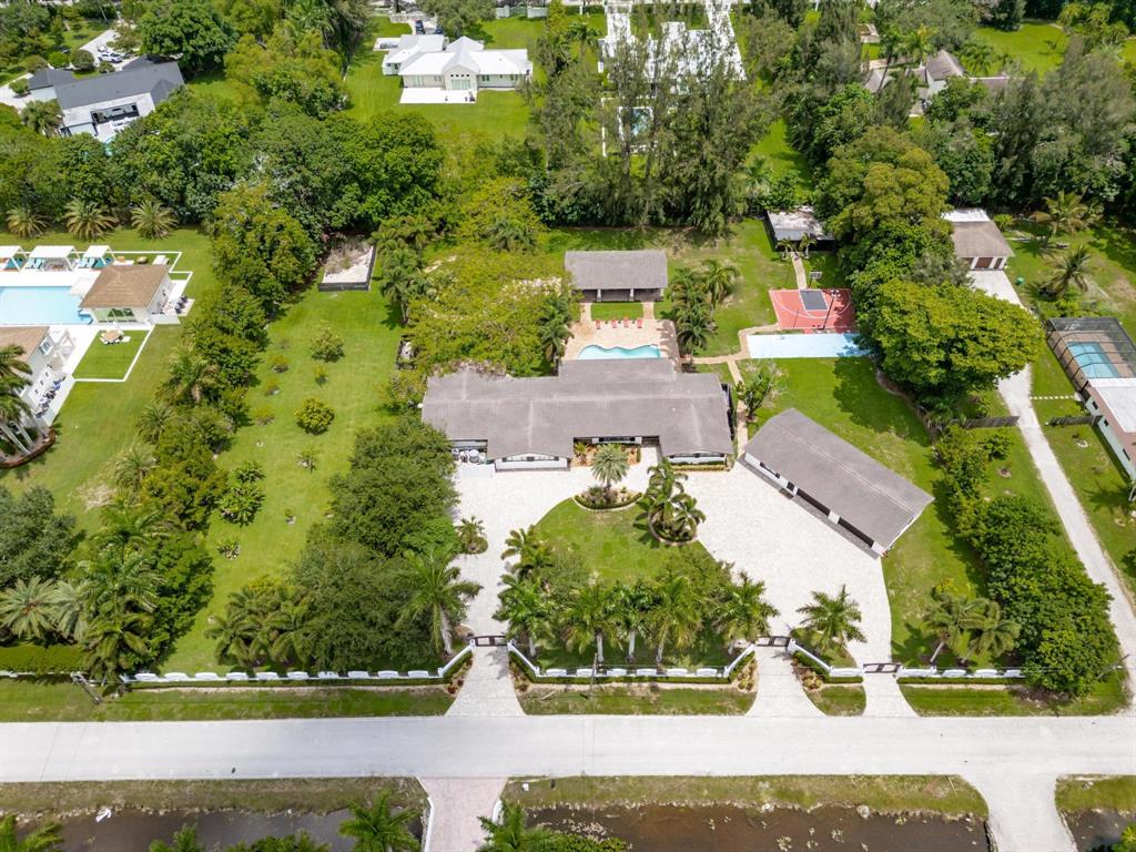 14701 Southwest 63rd Street Southwest Ranches, FL 33330 - Photo 72 of 75 an aerial view of a house with yard swimming pool and outdoor seating