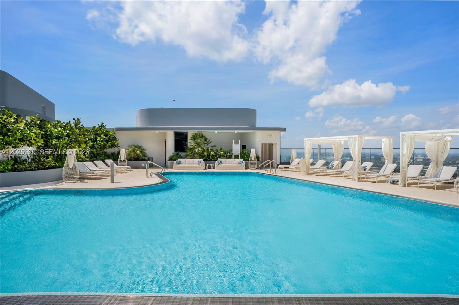 1000 Brickell, Unit 2014 Miami, FL 33131 - Photo 14 of 30 a front view of a house with garden