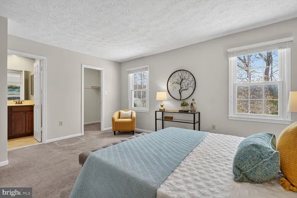 a living room with furniture and a lamp
