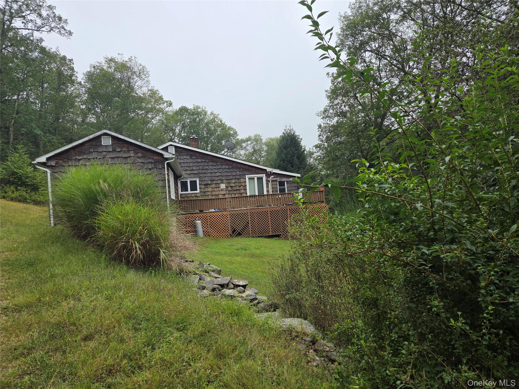 63 Otens Road Ellenville, NY 12428 - Photo 31 of 32 a house view with a garden space