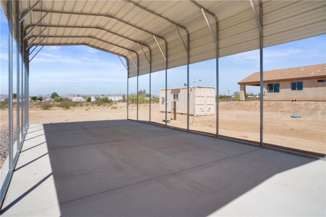 3328 Mobile Road Golden Valley, AZ 86413 - Photo 35 of 46 View of vehicle parking with a carport