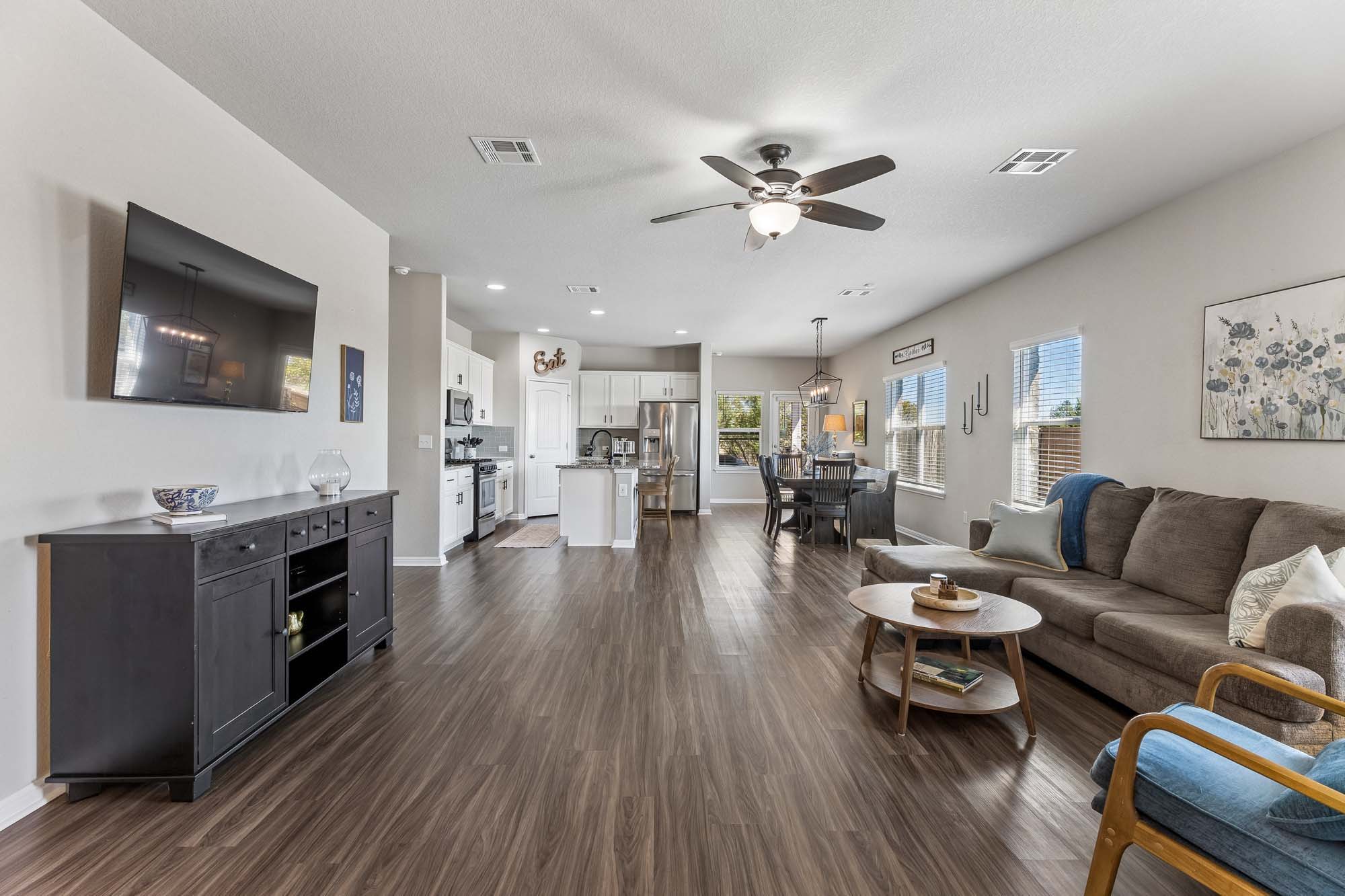 124 Moravia Road Georgetown, TX 78626 - Photo 37 of 38 An open floor plan seamlessly connects the central living area to the dining space and kitchen.
