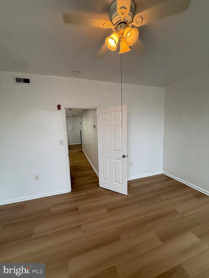 3227 Turner Street, Unit 2 Philadelphia, PA 19121 - Photo 3 of 6 a view of an empty room with wooden floor