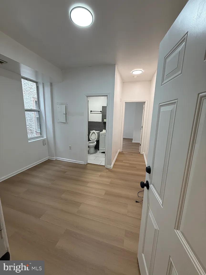 3227 Turner Street, Unit 2 Philadelphia, PA 19121 - Photo 6 of 6 a view of empty room with wooden floor
