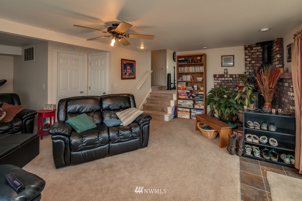 3359 Clearbrook Road Sumas, WA 98295 - Photo 11 of 25 a living room with furniture a bookshelf and a window