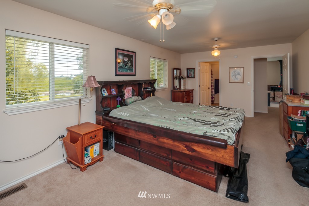 3359 Clearbrook Road Sumas, WA 98295 - Photo 14 of 25 a living room with furniture a large window and a flat screen tv