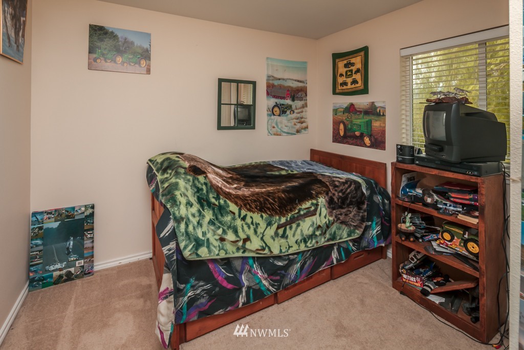 3359 Clearbrook Road Sumas, WA 98295 - Photo 16 of 25 a bed sitting in a bedroom next to a window