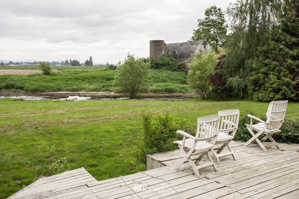 3359 Clearbrook Road Sumas, WA 98295 - Photo 3 of 25 a view of a deck with chair and wooden floor