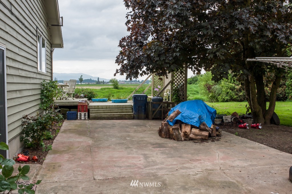 3359 Clearbrook Road Sumas, WA 98295 - Photo 4 of 25 a view of backyard with table and chairs and potted plants