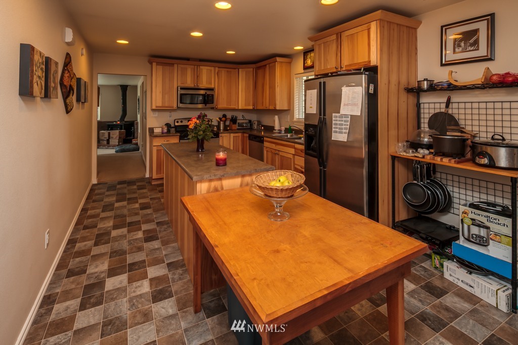 3359 Clearbrook Road Sumas, WA 98295 - Photo 7 of 25 a kitchen with stainless steel appliances granite countertop a refrigerator and a stove top oven