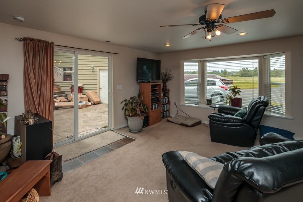 3359 Clearbrook Road Sumas, WA 98295 - Photo 9 of 25 a living room with furniture and a flat screen tv