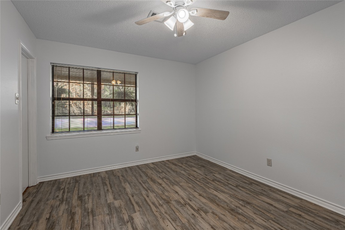 1 Cottonwood Trinity, TX 75862 - Photo 17 of 29 wooden floor in an empty room with a window