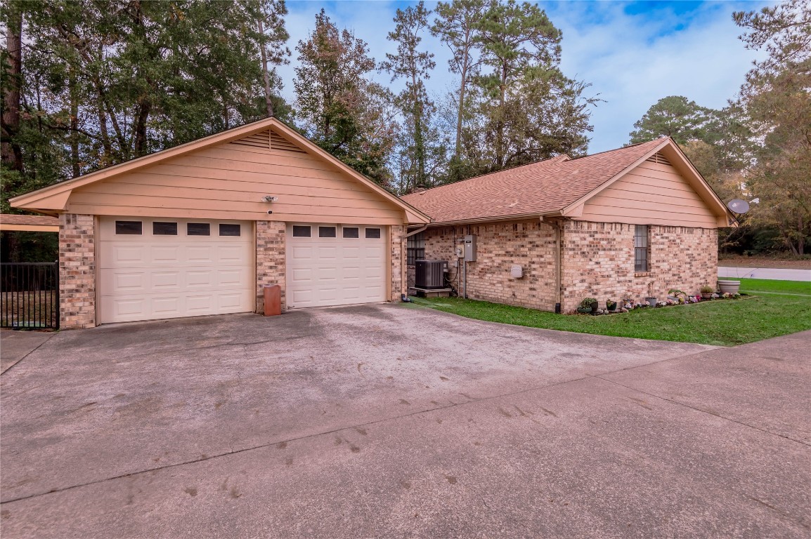 1 Cottonwood Trinity, TX 75862 - Photo 26 of 29 a view of a house with a yard and large tree