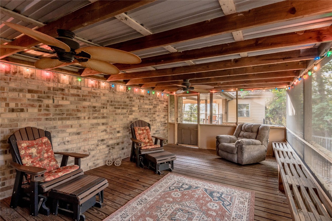 1 Cottonwood Trinity, TX 75862 - Photo 28 of 29 a living room with furniture a fireplace and a table