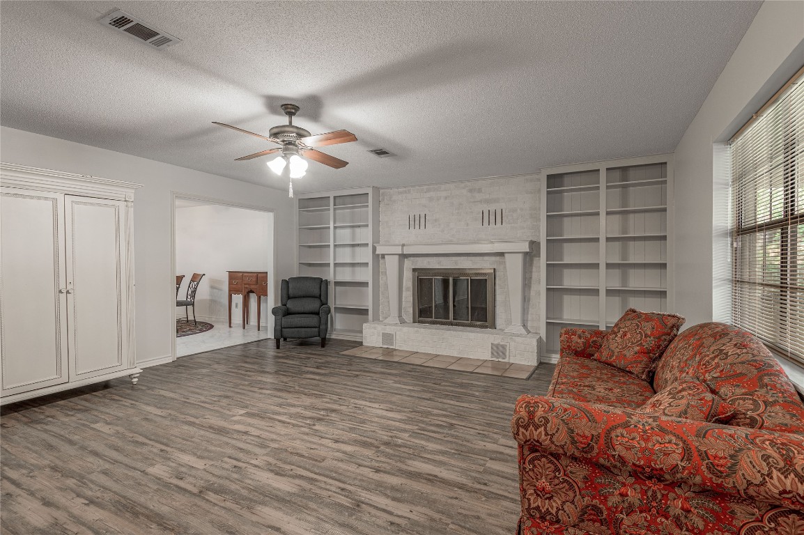 1 Cottonwood Trinity, TX 75862 - Photo 4 of 29 a living room with furniture a fireplace and a large window