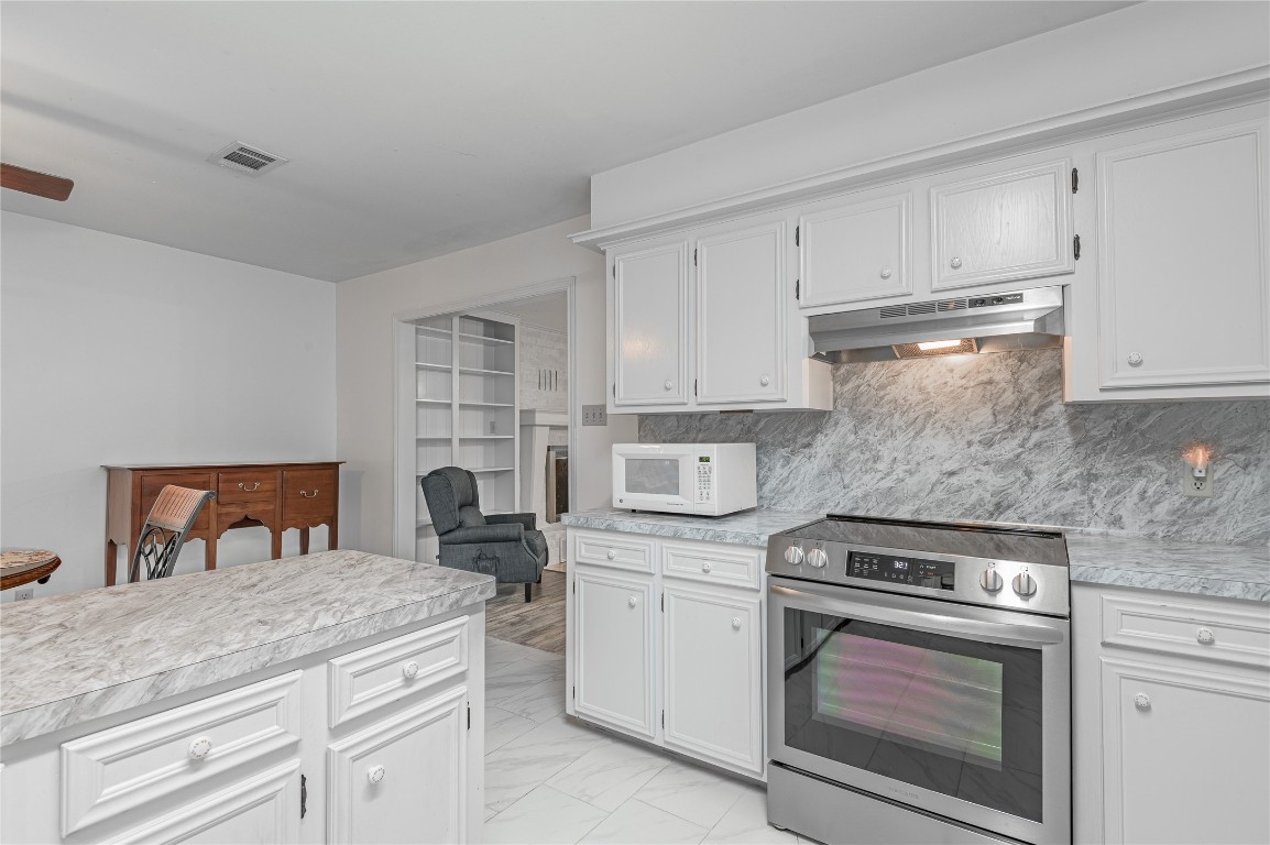 1 Cottonwood Trinity, TX 75862 - Photo 10 of 29 a kitchen with white cabinets and appliances