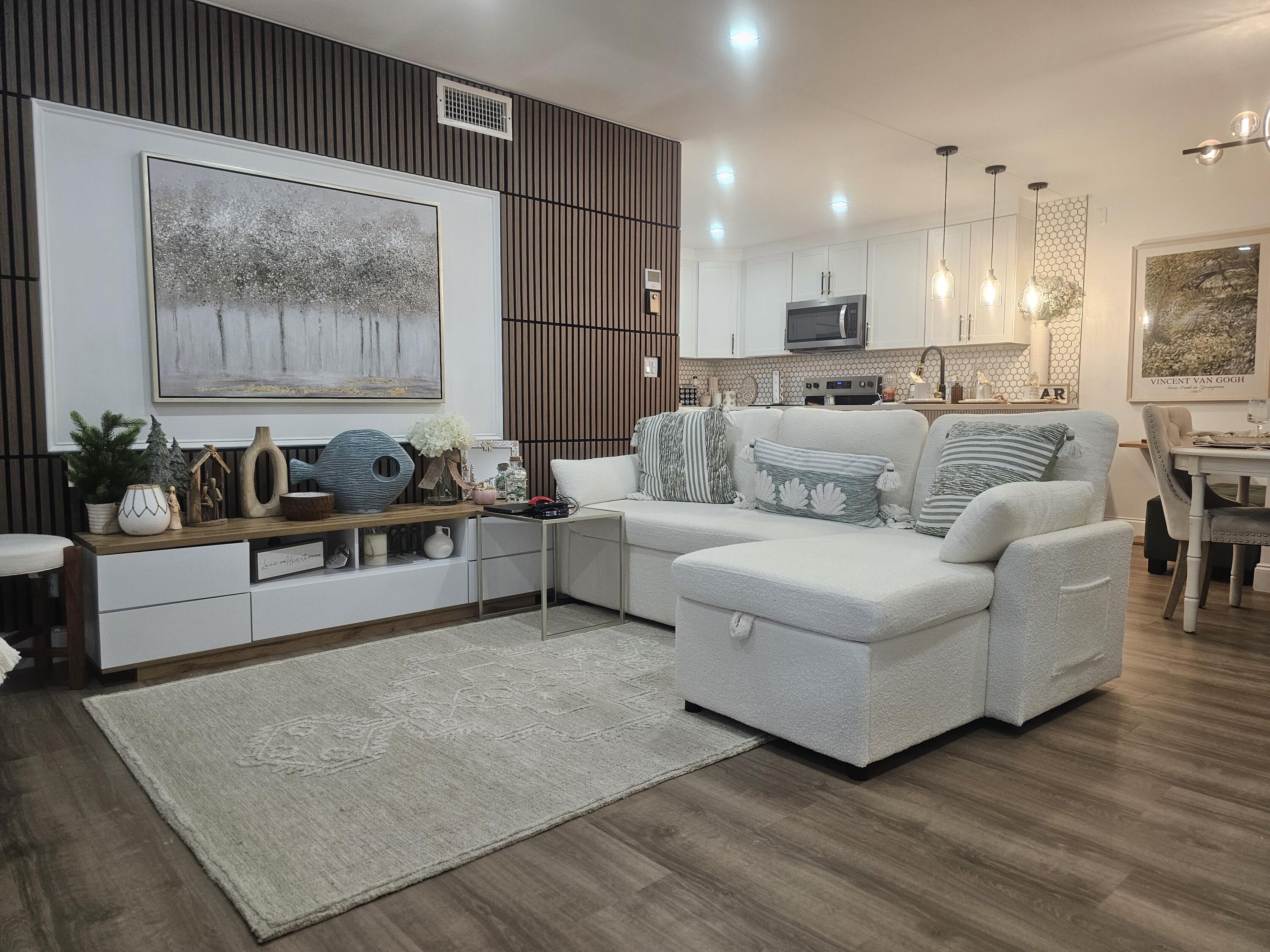 312 Pine Ridge Circle, Unit A2 Greenacres, FL 33463 - Photo 13 of 73 a living room with furniture and a large window