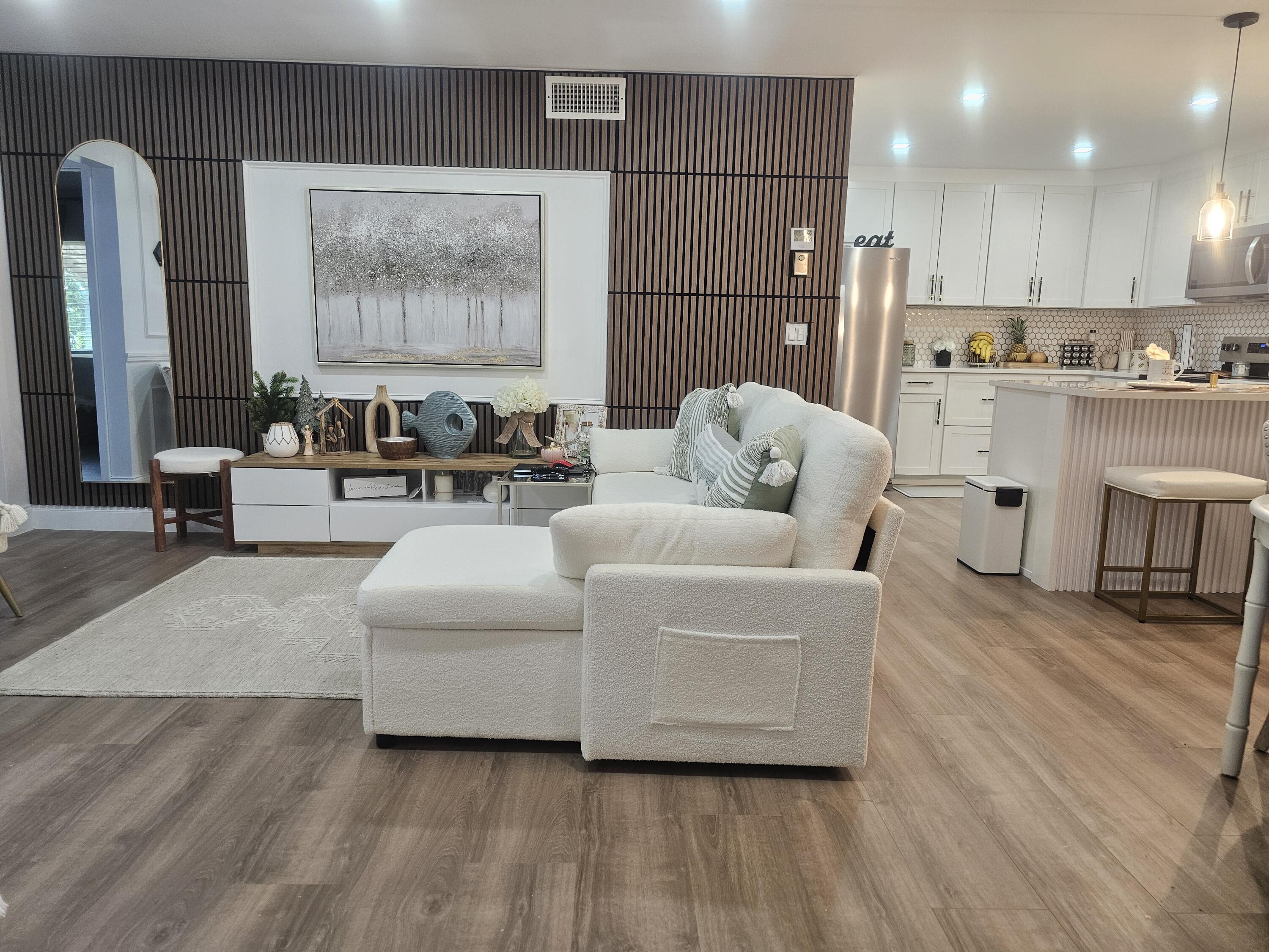 312 Pine Ridge Circle, Unit A2 Greenacres, FL 33463 - Photo 2 of 73 a living room with furniture and wooden floor