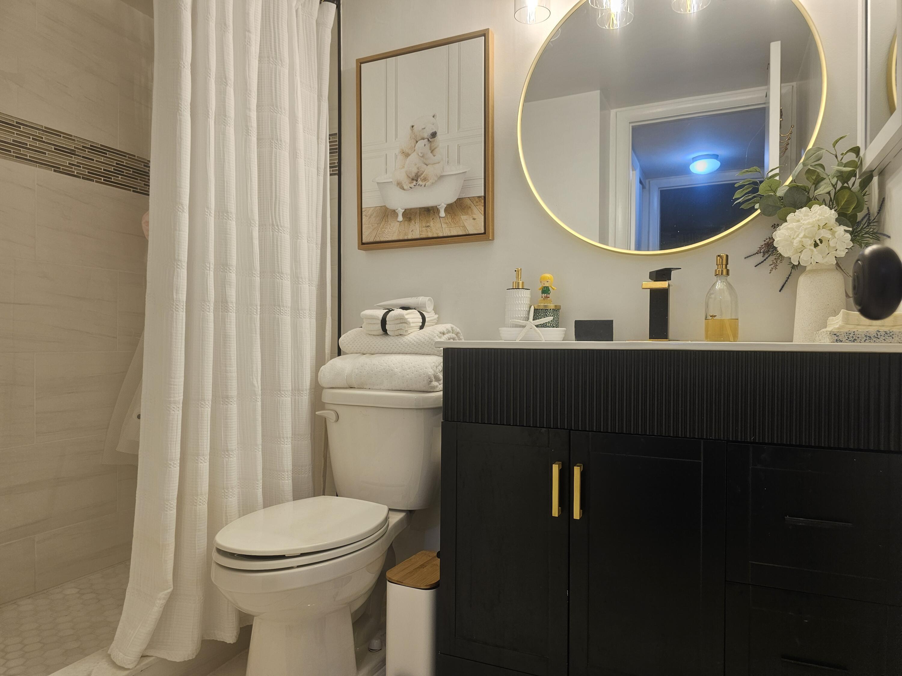 312 Pine Ridge Circle, Unit A2 Greenacres, FL 33463 - Photo 26 of 73 a bathroom with a sink and a mirror