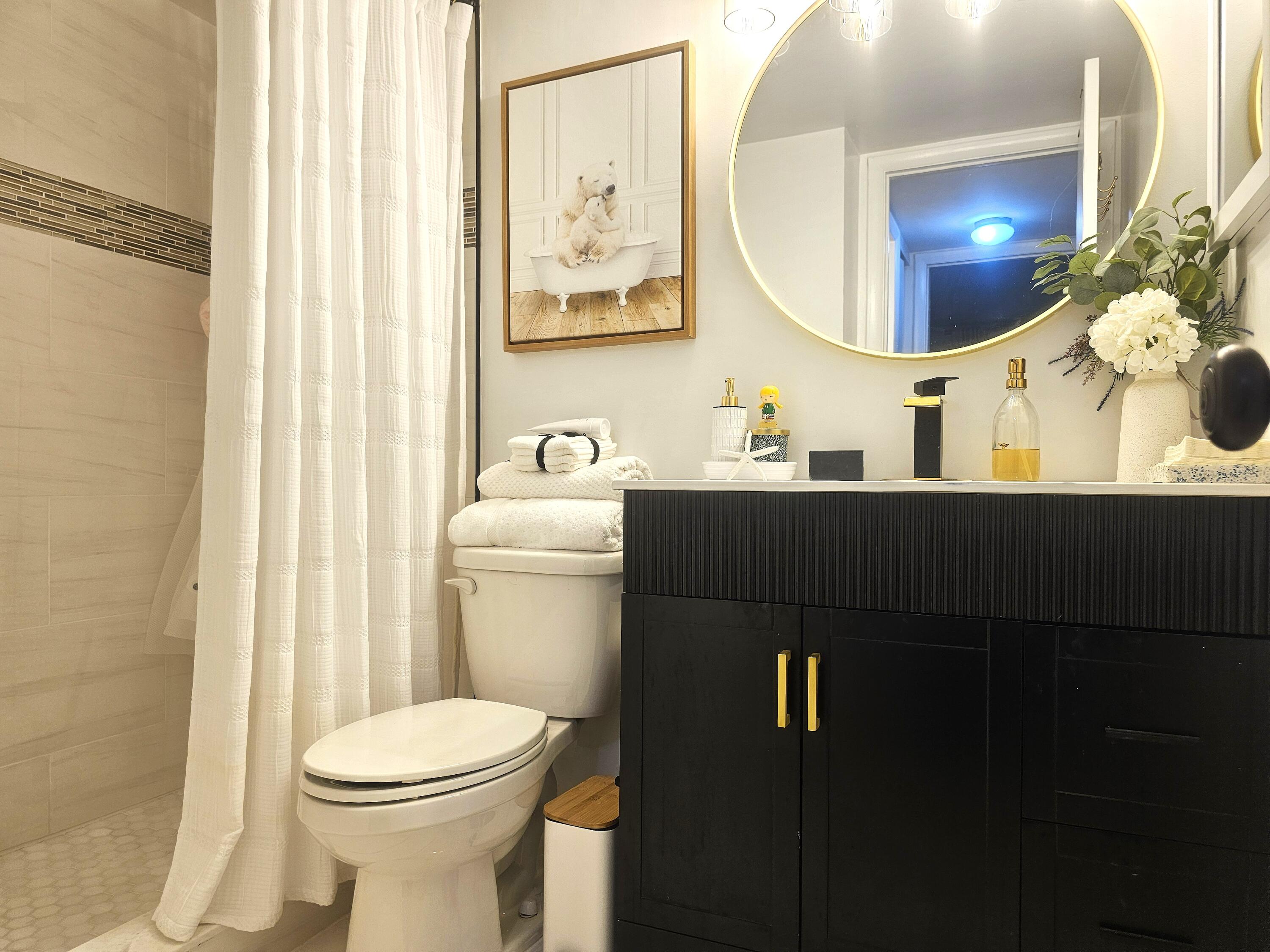 312 Pine Ridge Circle, Unit A2 Greenacres, FL 33463 - Photo 27 of 73 a bathroom with a sink and a mirror