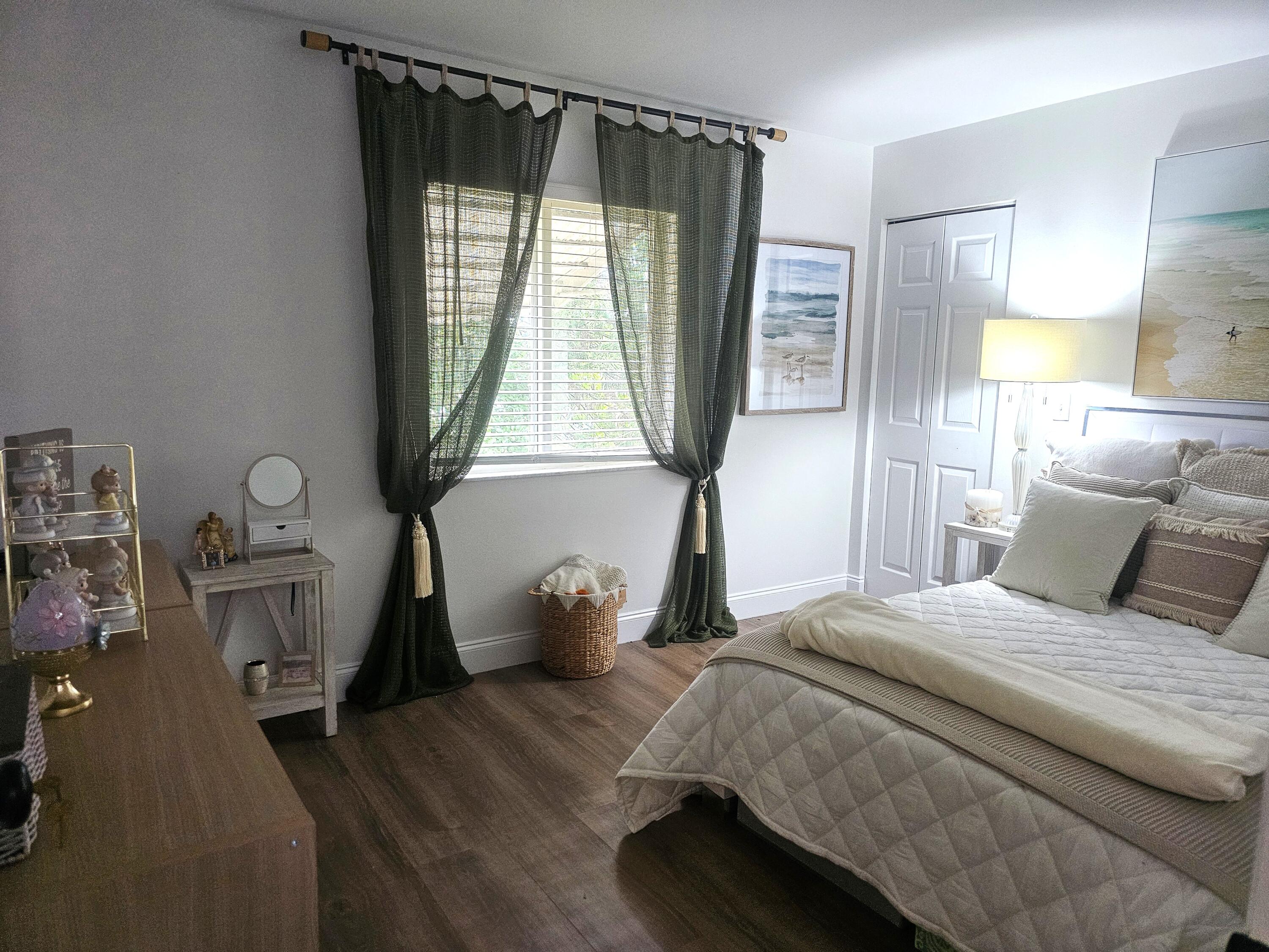 312 Pine Ridge Circle, Unit A2 Greenacres, FL 33463 - Photo 33 of 73 a bedroom with a bed and a window